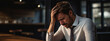 © Studio Nova - Businessman in depression sitting in his work office holding his head with his hand, suffering from overwork, stress or job loss