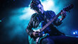 © MP Studio - Male musician playing guitar at a rock concert