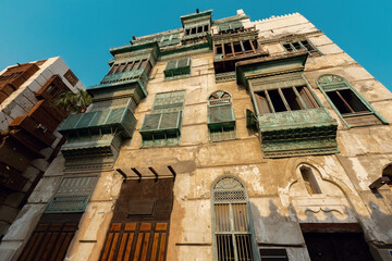 Traditional architecture of old Jeddah town El Balad district houses with wooden windows and balconies Unesco Heritage site in Jeddah Saudi Arabia