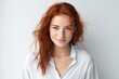 © Tixel - Portrait of beautiful young red hair woman with freckles smiling and looking at camera, standing on white isolated white background
