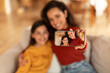© Prostock-studio - Middle Eastern Mom And Daughter Making Selfie Via Phone Indoor