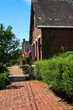 Old homes along a brick sidewalk in German Village in Columbus, Ohio, preserve much of the ambiance of 19th century charm.