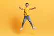 © Prostock-studio - Cute preteen cheerful boy jumping in the air