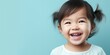 Leinwanddruck Bild - Little cute asian baby blue background. Place for text. Generative AI