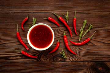 Wall Mural - Spicy seasoning - red chili pepper and sauce, top view
