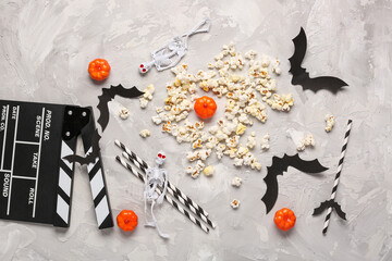 Sticker - Movie clapperboard, popcorn and Halloween decor on grey grunge background