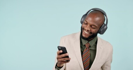 Leinwandbilder - Business man, phone and dancing with headphones in studio internet, energy and app. Happy, smartphone and a professional person from Kenya on a blue background listening or streaming music online