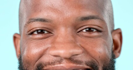 Wall Mural - Eyes, vision and hope with a happy black man closeup in studio on blue background for a dream or aspiration. Portrait, face or eyesight and a confident young person looking peaceful with satisfaction