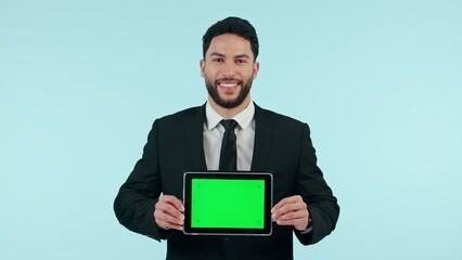 Poster - Businessman, tablet and green screen in studio for marketing or advertising tracking markers on blue background. Smile, person and digital tech with product placement or design for social media web