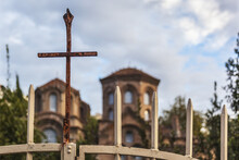 A Rusty Cross On A Gate In Front Of A Church; Thessaloniki, Greece
