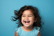 © gaukharyerk - Studio portrait of cuttle little laughing girl on different colours background