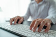 © chathuporn - businessmen's hands typing on keyboard to do his job at office. hands adult typing on computer keybord.