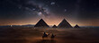 three people riding on camels in the desert in front of a pyramid and night sky