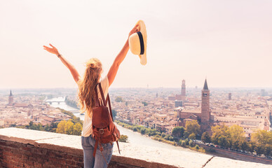 Canvas Print - Happy female tourist enjoying panorama of Verona city landscape- Travel destination in Italy