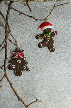 Gingerbread Man And Gingerbread Christmas Tree Hanging On Branches
