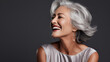 closeup portrait the genuine laughter and  smile of a graceful elderly model with silver hair, perfect for promoting dental health, portrait of a woman