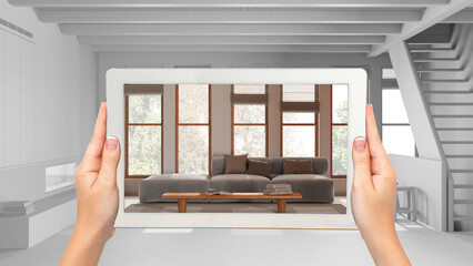 Wall Mural - augmented reality concept. hand holding tablet with ar application used to simulate furniture and de