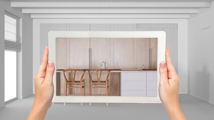 Wall Mural - augmented reality concept. hand holding tablet with ar application used to simulate furniture and de
