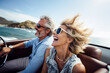 Happy smile aged couple man and woman traveling in car convertible the coast on summer sunny day.	