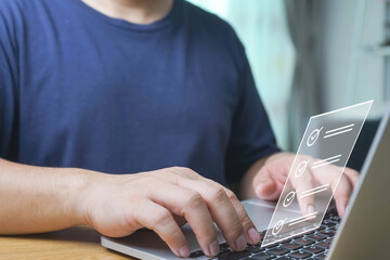 Business performance checklist, Quick checklist and clipboard management concept, job applicants, businessman using laptop doing online checklist survey,Employees must complete the online survey form.