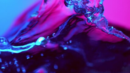 Canvas Print - Super Slow Motion of Splashing Water Waves Illuminated by Neon Lights. Filmed on High Speed Cinema Camera, 1000 fps.