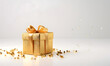 © Orkidia - A beautiful gold Christmas present on a solid color background - festive glitter and ribbons design
