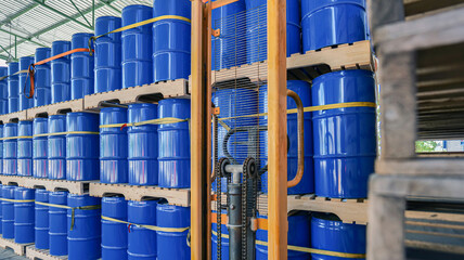 Chemical storage tanks neatly stored on wooden pallets in Warehouse. Warehouse management and industrial chemistry concept.