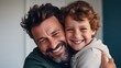 © Virtual Art Studio - Portrait of happy father and smiling son embracing together.