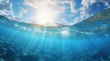 Bright Sunlight Shining Through Clear Blue Water. Warm Summer Ocean With Rocky Bottom.