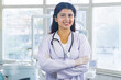 © Jasper Neupane - Confident Nepali Doctor Female Asian Standing in a Dental Hospital