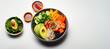 healthy poke bowl salad meal of Salmon, avocado, cucumber, tomato, beans and rice on white background