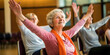 © Justlight - An engaging snapshot showcasing elderly participants comfortably seated on chairs, demonstrating chair yoga exercises that target the wrists and hands, enhancing joint mobility and