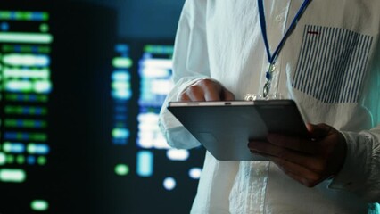 Poster - Certified technician strolling through server rows providing processing resources for different workloads. Adept expert monitoring supercomputers tasked with solving complex operations, close up