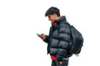 © carballo - boy with mobile phone on the street in warm clothes