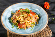© Luis Echeverri Urrea - Delicious fettuccine pasta with Spanish sausage - dark background