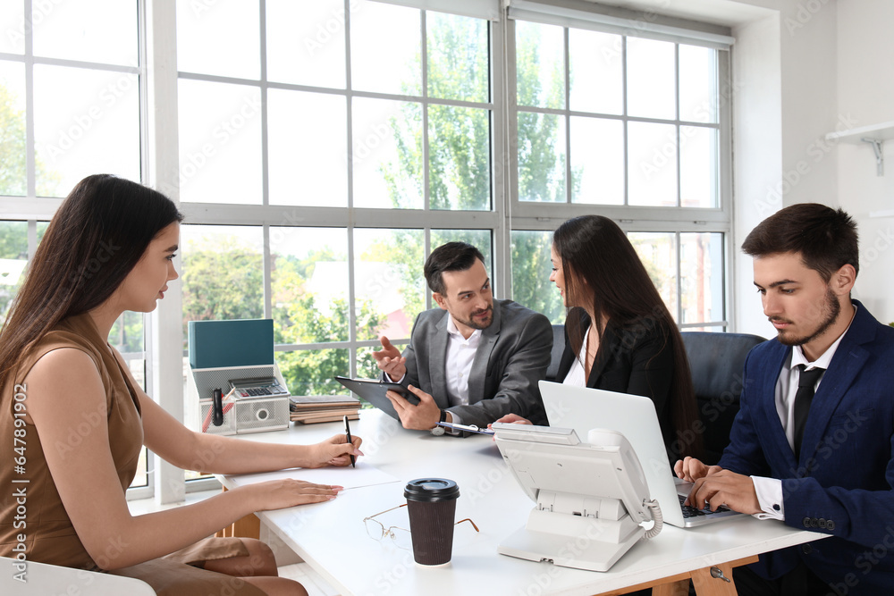 Human resources commission interviewing female applicant in office