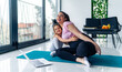 © DusanJelicic - Young pregnant woman and her little daughter practicing yoga at home, mother daughter bounding concept