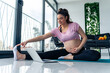 © DusanJelicic - sporty pregnant woman sit on mat meditate practice yoga with online class on computer at home.