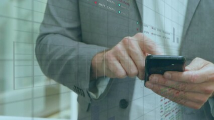 Canvas Print - Animation of stock market data processing over mid section of a businessman using smartphone