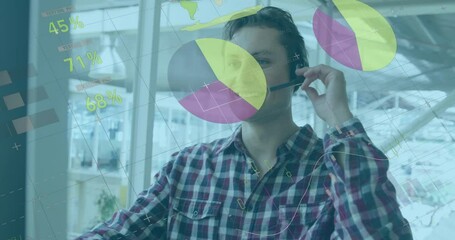 Wall Mural - Animation of statistical data processing against caucasian man talking on phone headset at office