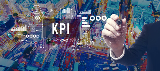 Poster - KPI - Key Performance Indicator theme with businessman in a city at night