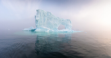 Wall Mural - Antarctica, South Georgia Island. A lonely glacier. Blue glaciers in the ocean water. Glacial drift on calm water. Clean chunks of ice from a melting glacier. Global warming concept climate change.