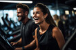 © fotogurme - Active individuals engaged in motivational personal training session at modern fitness club