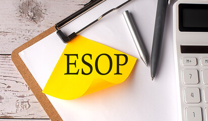 Poster - ESOP word on yellow sticky with calculator, pen and clipboard