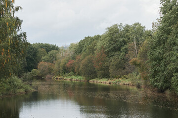 Wall Mural - Lenaelva River by the Haajendammen Dam, Toten, Norway, in early fall.