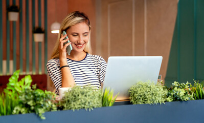 Wall Mural - Portrait of happy woman smiling and using mobile phone. People technology social network concept