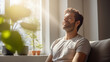 © Keitma - Portrait of a Happy Man Practicing Relaxation Exercises at Home in His Spacious and Bright Flat
