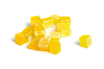 Wall Mural - Dried mango cubes isolated on white. Diced mango closeup. Heap of sweetened fruits