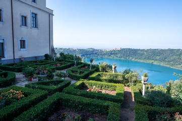 Small historical town Nemi, view on green Alban hills overlooking volcanic crater lake Nemi, Castelli Romani, Italy in summer