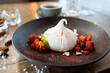 Pavlova berry cake with passion cream, strawberry, meringue. Delicious sweet dessert food closeup served for lunch in modern gourmet cuisine restaurant